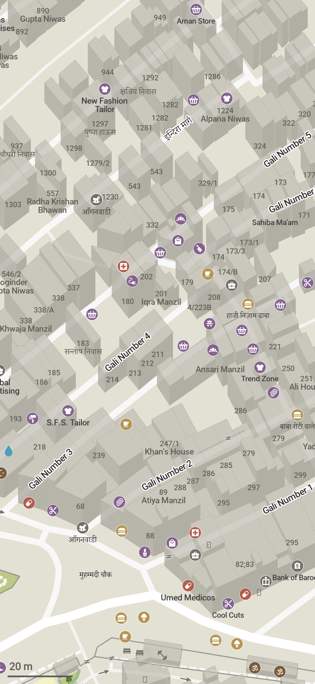 Screenshot of Organic Maps, rendering the southern tip of the part of Mandāwali I have been mapping. The higher zoom shows more POIs and address labels. The missing buildings are the ones with no address signs - I plan to go there again and ask the residents for the house number.
